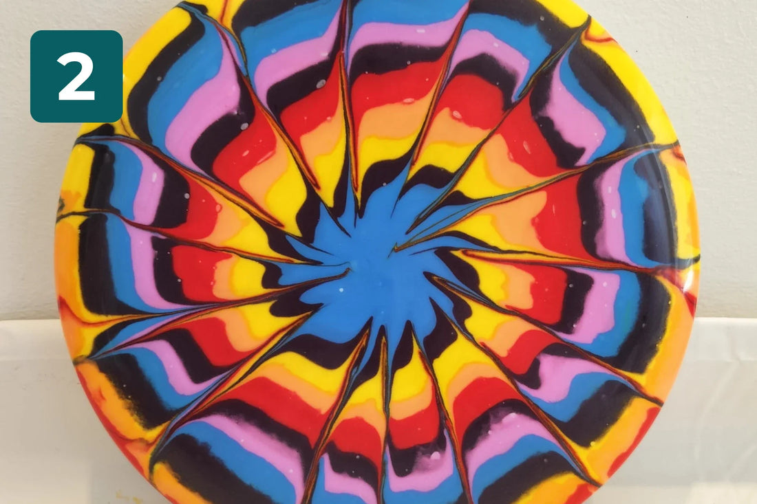 Disc with a colorful star pattern made with the lotion method